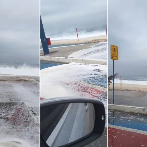 Ondas invadem avenida em Maricá; homem perde chinelo e banhista cai durante ressaca; VÍDEO